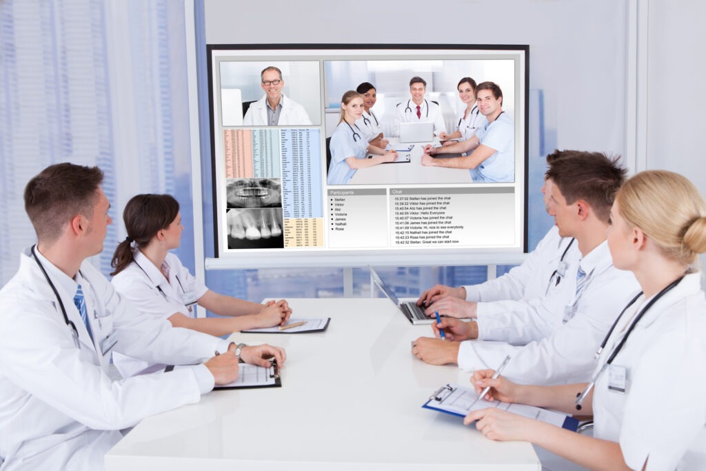 Team of doctors having video conference meeting in hospital