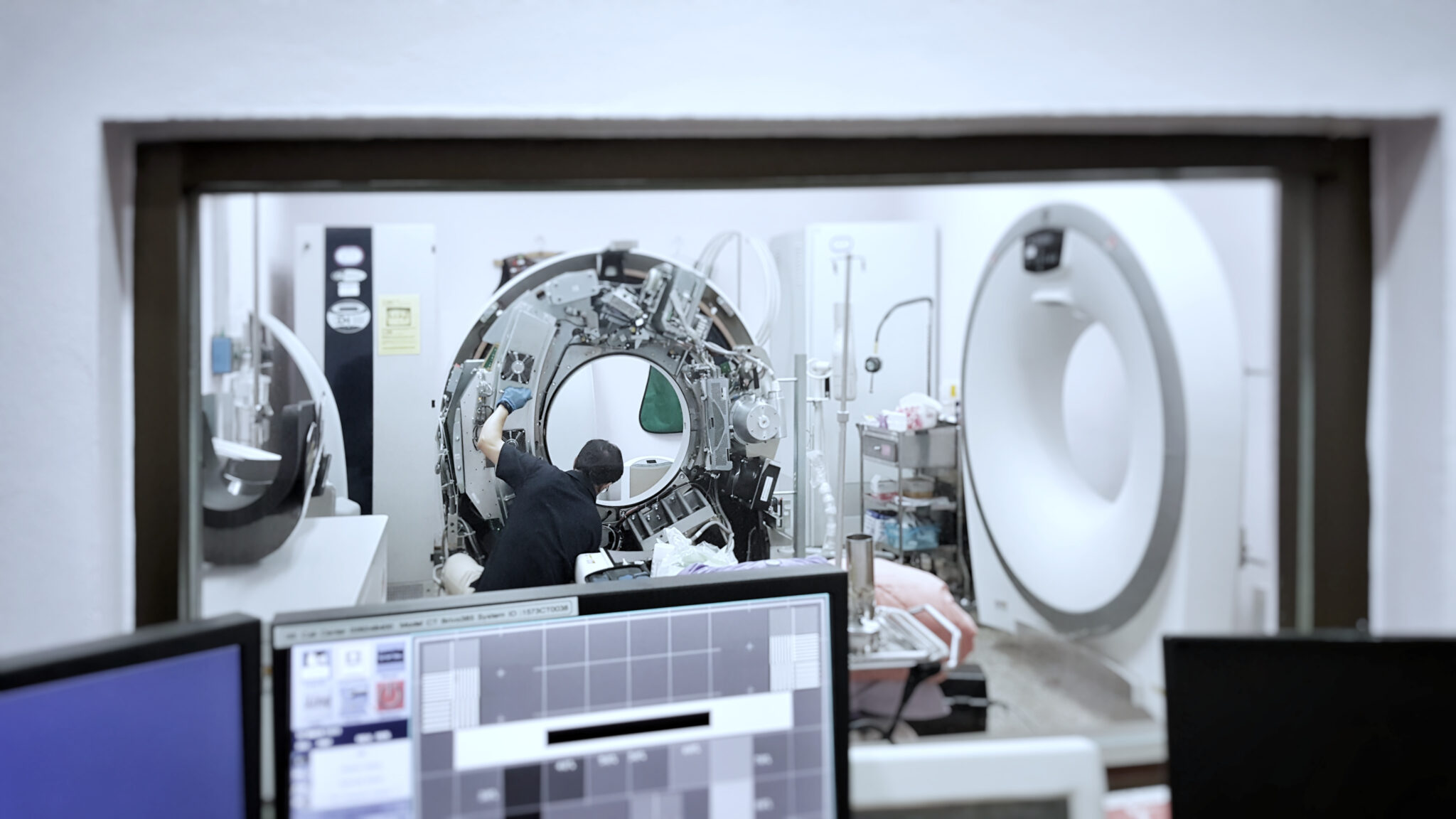 HTM Engineer works on CT Scanner